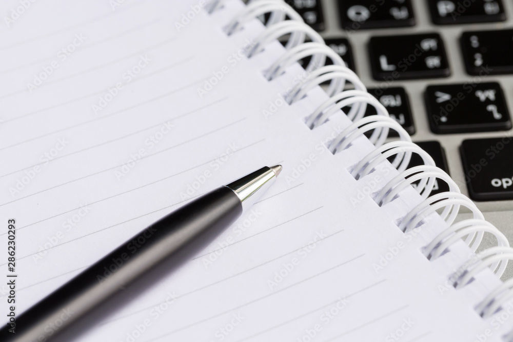 Close up of pen and notebook, Business Background Close up of pen and notebook, Business Background