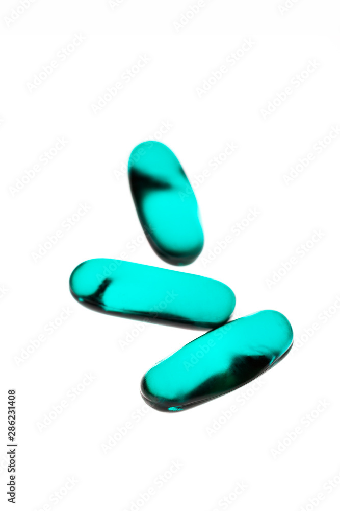 Bad shape expired blue pills on background Bad shape expired blue pills on background
