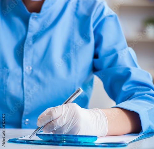 Female scientist researcher conducting an experiment in a labora