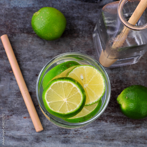 Top view lemons and lime slices detox water