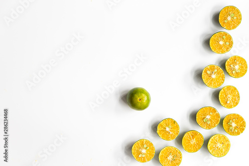 Top view, flat lay of fresh mandarin oranges on white background with copy space.