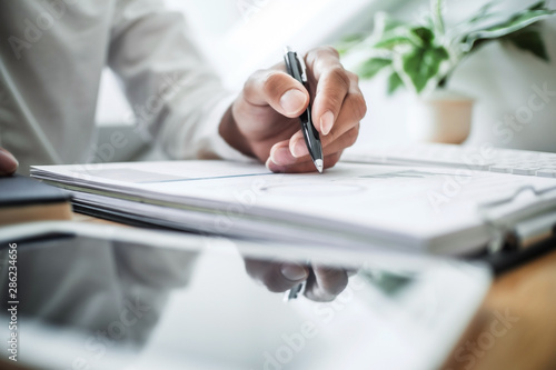 Tableau sur toile auditor or financial inspector working on business report