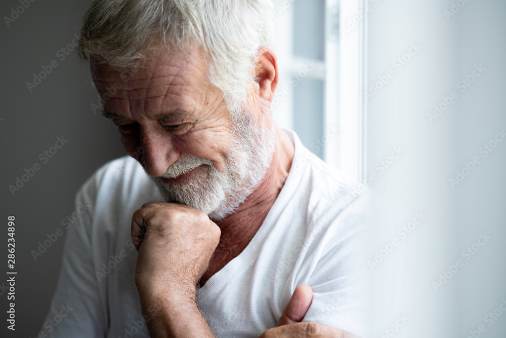 Happy senior man portrait. Bearded man. Small laugh. Happy senior man portrait. Bearded man. Small laugh.