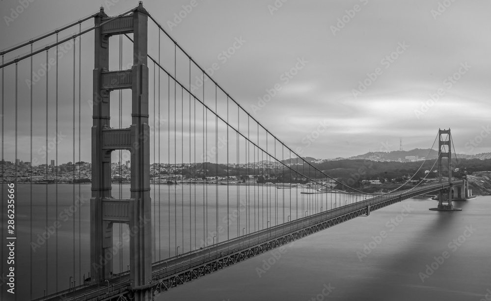 Black and white of the Golden Gate Bridge without people or cars or boats on or off the bridge