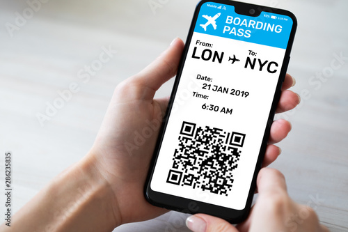Flight Boarding pass on mobile phone screen. Online registration. Internet business and technology concept.