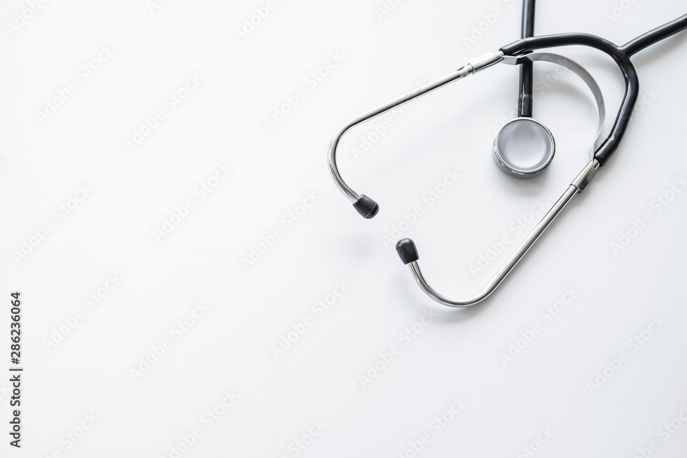 A stethoscope on white background with copy space. A stethoscope on white background with copy space.