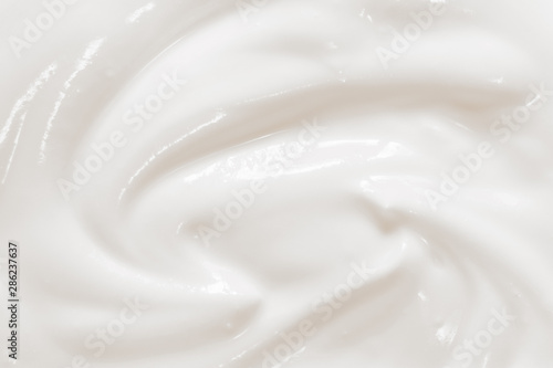 Sour cream, creamy yogurt texture. White dairy food background