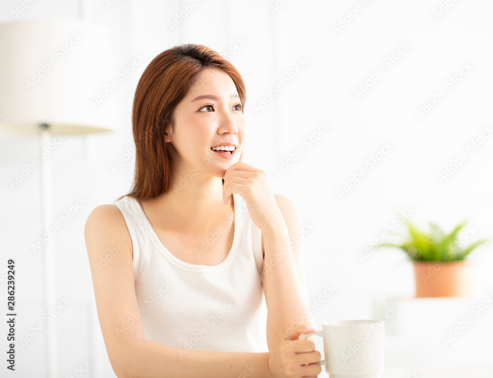 closeup smiling young asian woman in living room closeup smiling young asian woman in living room