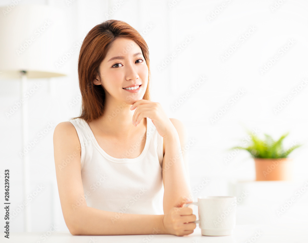 closeup smiling young asian woman in living room