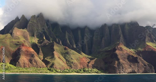 Hawaii beach, Kauai. Na pali coast view from water. Famous Hawaiian travel destination. Napali coastline in Kaui, Hawaii, USA, the Honopu arch. photo