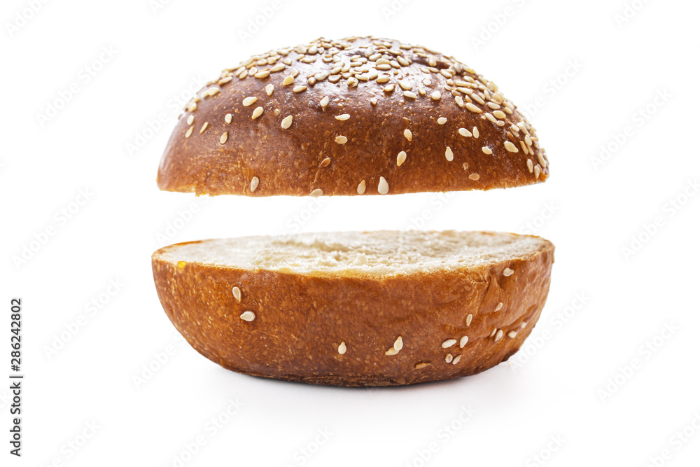 Homemade sourdough bread. Burger bun isolated on white background Homemade sourdough bread. Burger bun isolated on white background
