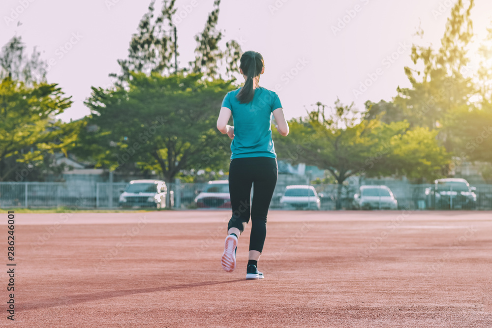 Runner Women jogging or running in evening at sunlight,Lady run jogging or exercise,Woman Runner or Girl Running Good Healthy strong