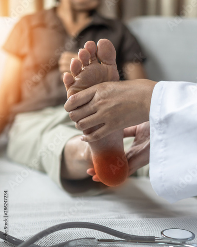 фотографія Plantar Fasciitis or heel pain illness in feet of woman patient who having medic