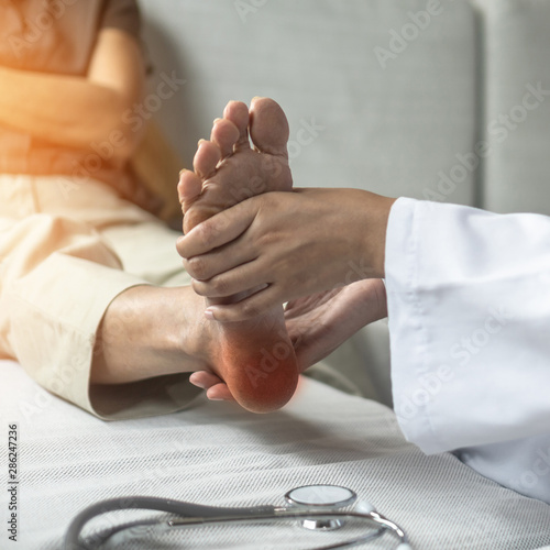 Bild auf Leinwand Plantar Fasciitis or heel pain illness in feet of woman patient who having medic