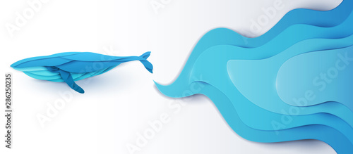 Cartoon humpback whale with blue waves isolated on white background in trendy paper cut craft graphic style. Vector illustration.
