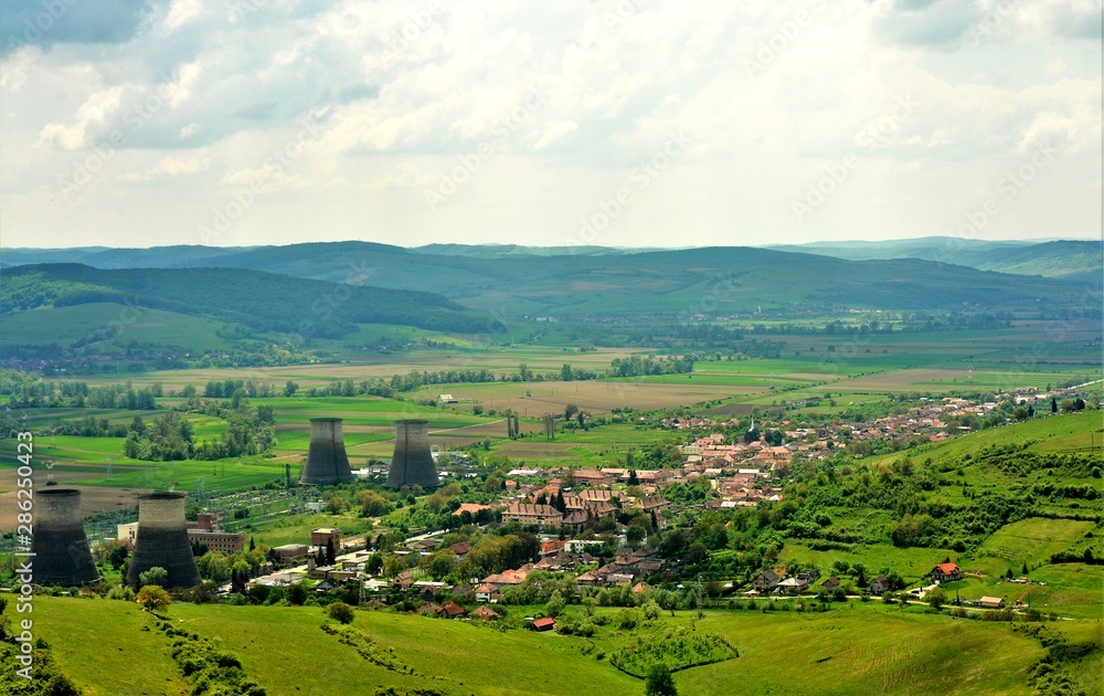 landscape with a village between hills in Romania
