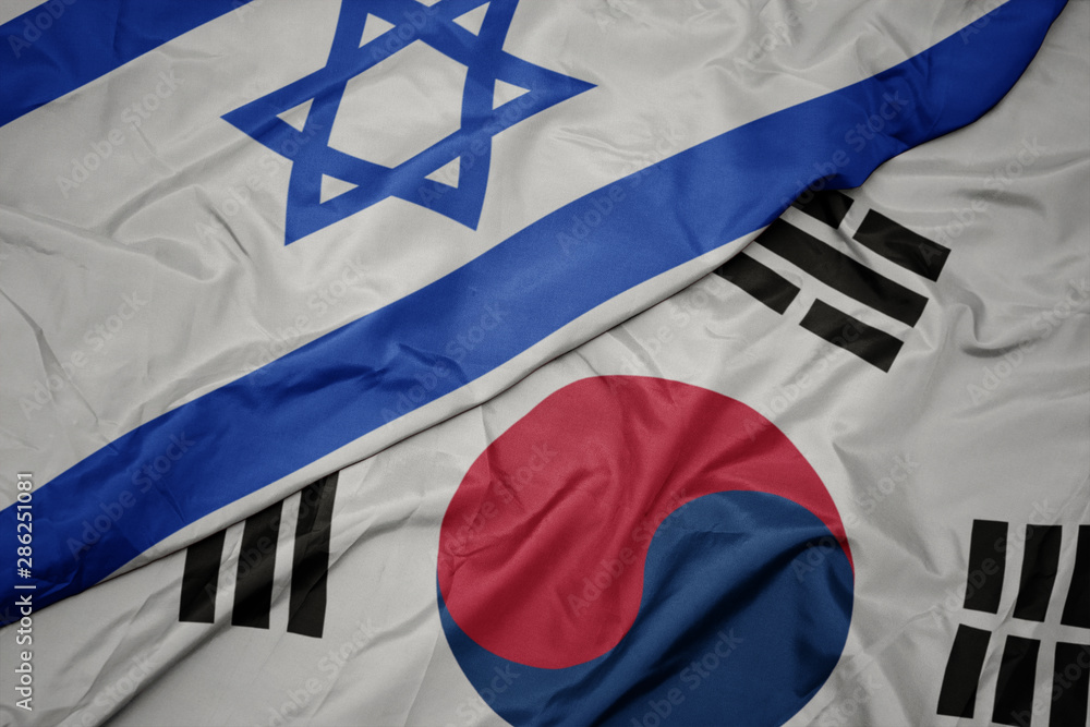 Fototapeta premium waving colorful flag of south korea and national flag of israel.