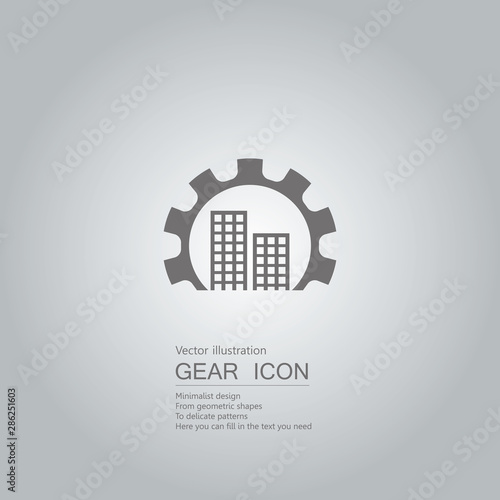 Gears and city. The background is a gray gradient.