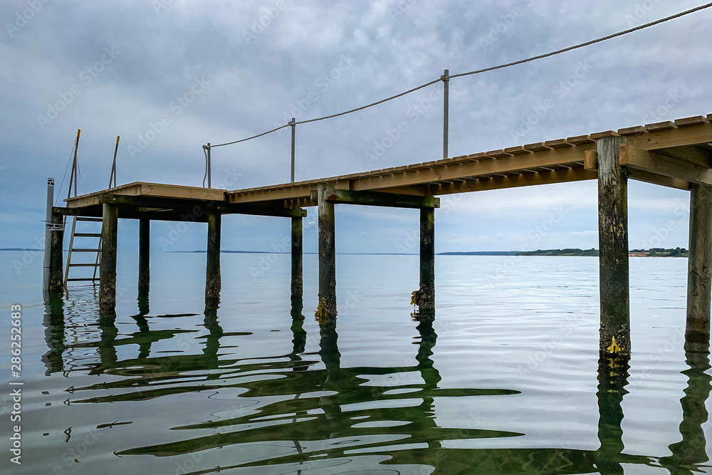 Obraz premium Reflections of a Pier on the Sea - Jutland - Denmark