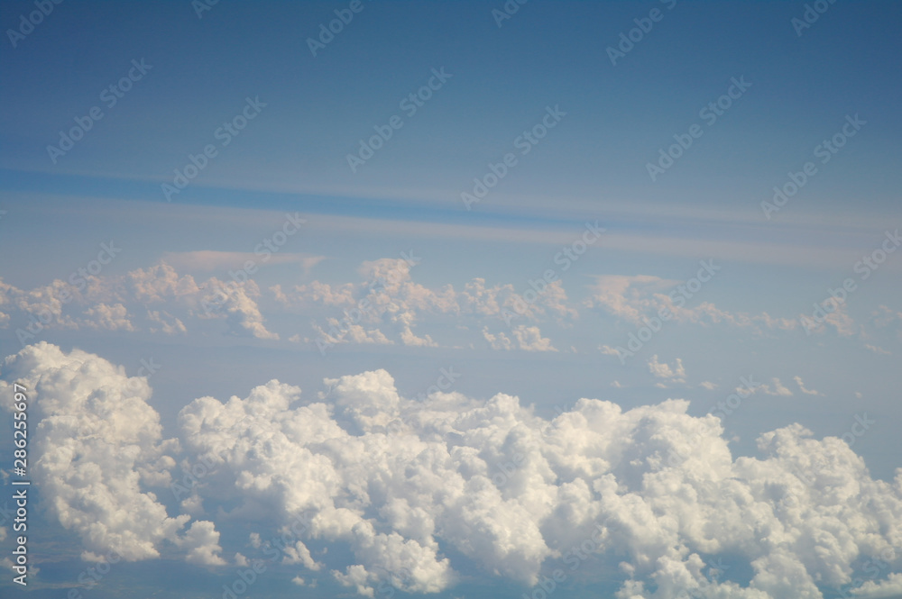 clouds and blue sky seen from plane