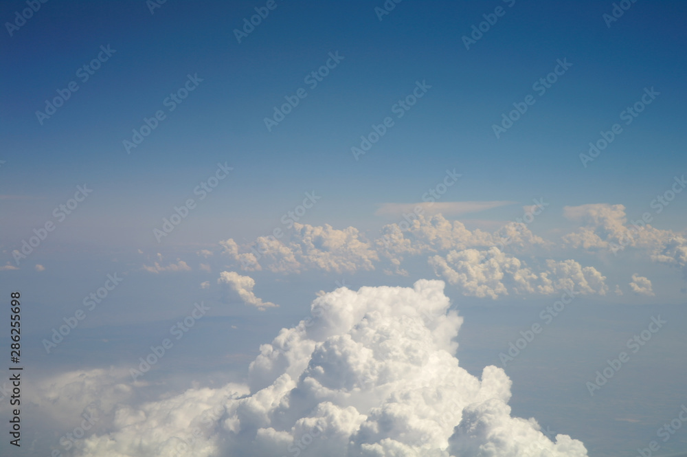 clouds and blue sky seen from plane