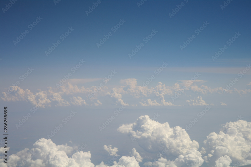 clouds and blue sky seen from plane
