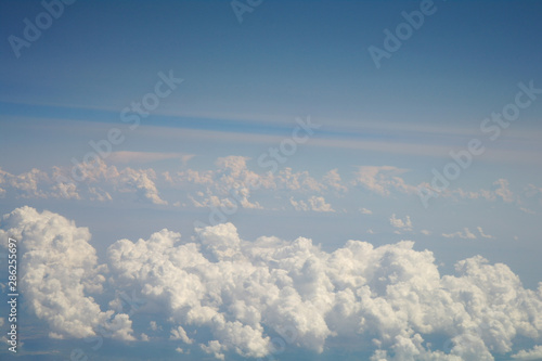 Obraz na płótnie clouds and blue sky seen from plane w salonie