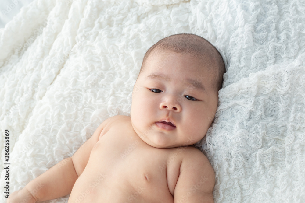 Baby lying on the bed Baby lying on the bed