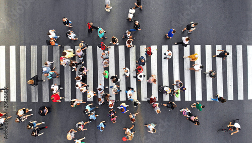 Crowded pedestrian crosswalk. Top view from drone.