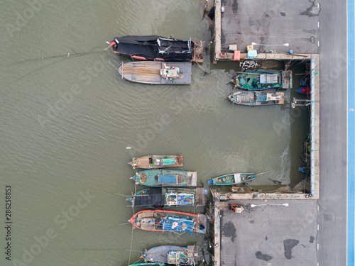 Aerial top view of a many Fishing boats at harbour in chonburi, thailand. © KissShot