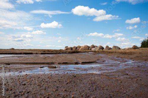 coast of sea, stream on the sandy beach