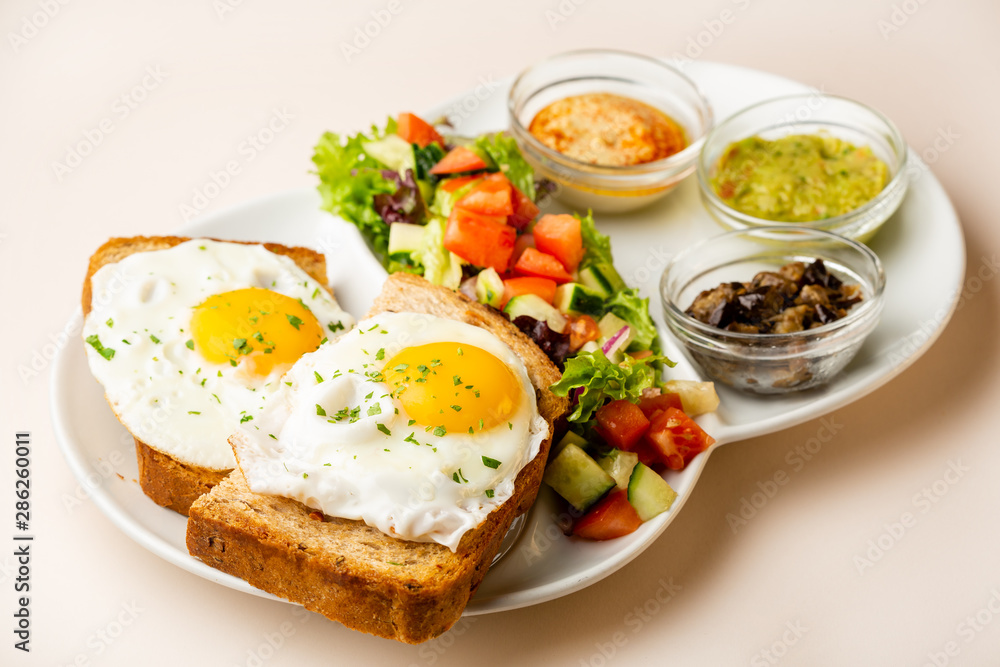 healthy breakfast with fried eggs and sauce healthy breakfast with fried eggs and sauce