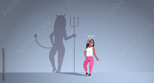 african american girl with nimbus choosing between good and evil shadow of devil imagination aspiration concept female cartoon character standing pose full length flat horizontal