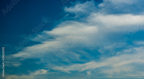 Fantastic soft white clouds against blue sky