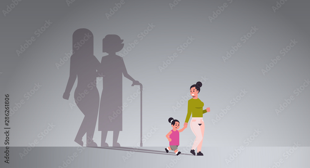 mother with daughter holding hands shadow of young and mature woman standing together imagination aspiration concept full length flat horizontal mother with daughter holding hands shadow of young and mature woman standing together imagination aspiration concept full length flat horizontal
