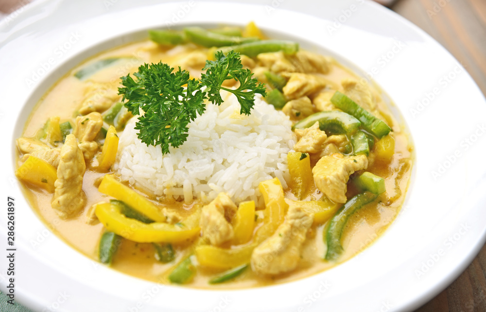 Stir Fried turkey with yellow curry and paprika in cream sauce Served with rice Stir Fried turkey with yellow curry and paprika in cream sauce Served with rice
