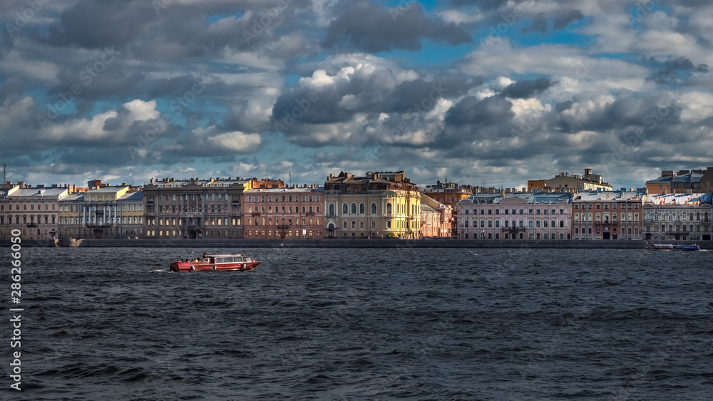 Beautiful landscape with floating passenger ship on the Neva river in St. Petersburg. Russia.