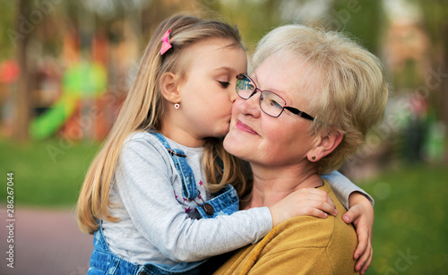 Quadro su tela Hug for a grandmother. Family, lifestyle concept