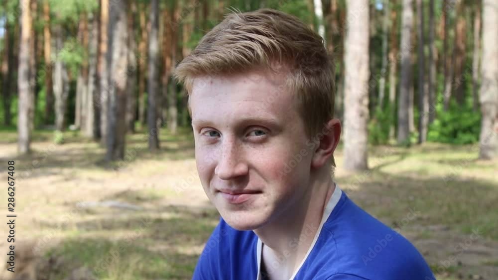 Portrait of teenager outdoors on blurred background. Portrait of teenager outdoors on blurred background.