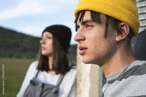 Portrait of a young couple with modern style smiling and happy