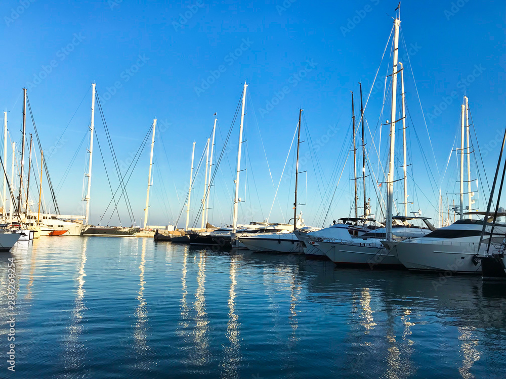 Fototapeta premium MALLORCA, SPAIN / Balearic - March 1, 2019: Marina port with yachts in Palma de Mallorca at Balearic Islands Spain. Carrer Del Moll marina skyline