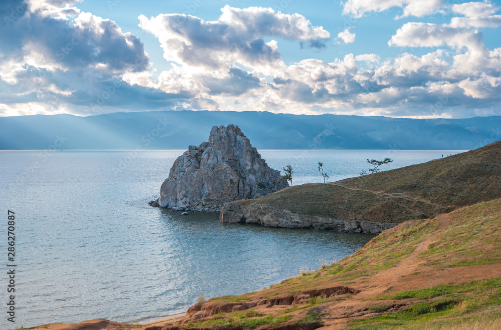 The beautiful landscape of Lake Baikal overlooking the Shamanka Rock or Cape Burkhan. One of the main attractions of the Olkhon island.