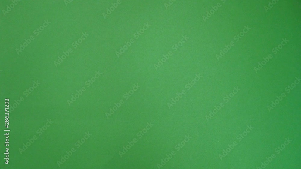 Hand gestures thumb up. Woman hand with red manicure showing thumbs up over green background. Hand gestures thumb up. Woman hand with red manicure showing thumbs up over green background.