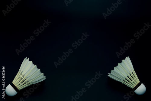 Badminton shuttlecock on black background.