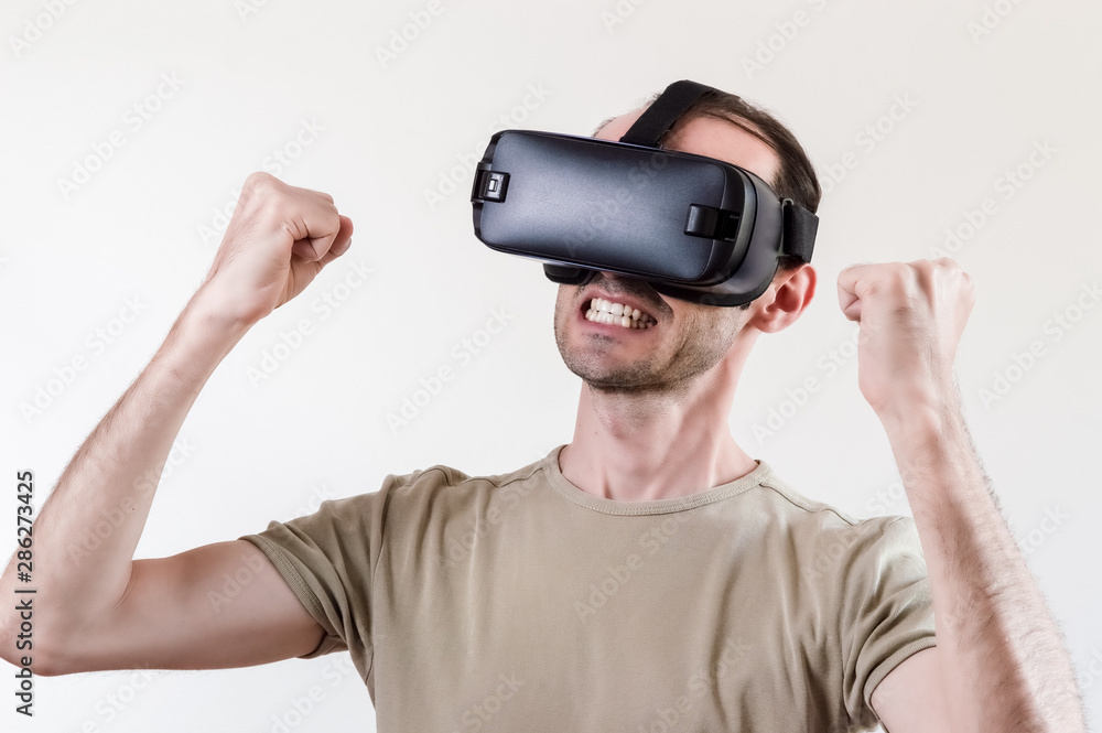Man exploring modern technology virtual reality with head mounted display on white background Man exploring modern technology virtual reality with head mounted display on white background