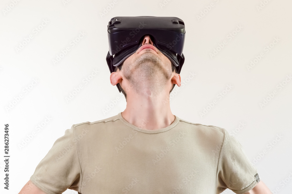 Man exploring modern technology virtual reality with head mounted display on white background Man exploring modern technology virtual reality with head mounted display on white background