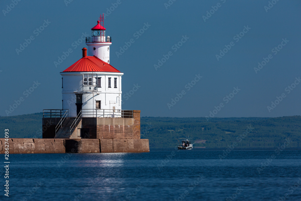 Wisconsin Point Lighthouse On Lake Superior with Fishing Boat