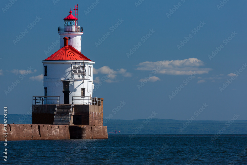 Wisconsin Point Lighthouse On Lake Superior with Distant Ship