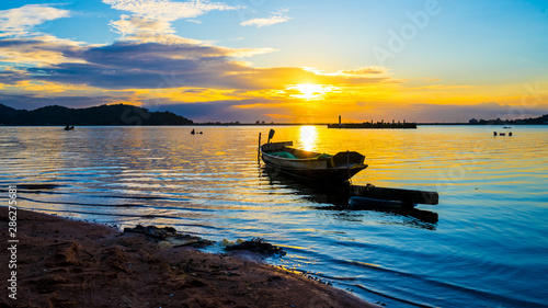 Fishing boat with sunset at Bang phra reservoir ,sriracha chon buri, thailand