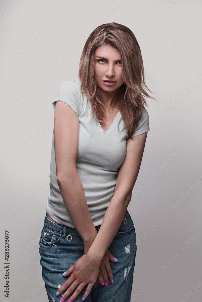 happy smiling beautiful young woman in white top and jeans happy smiling beautiful young woman in white top and jeans